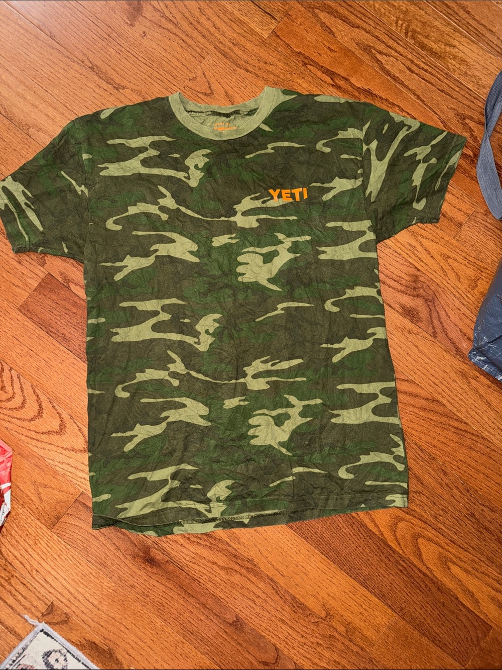 Yeti Green Camo T-Shirt with Orange Logo
